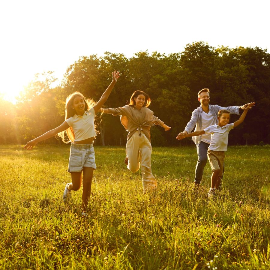 Happy,Family,Running,And,Having,Fun,In,Summer,Park,Enjoying